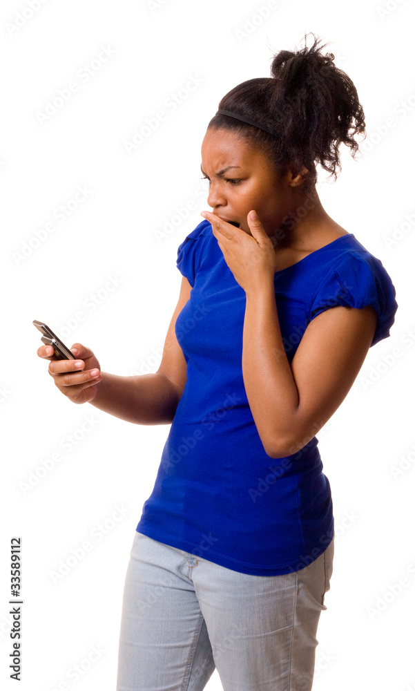 woman looking shocked holding a mobile phone. woman looking shocked holding a mobile phone.