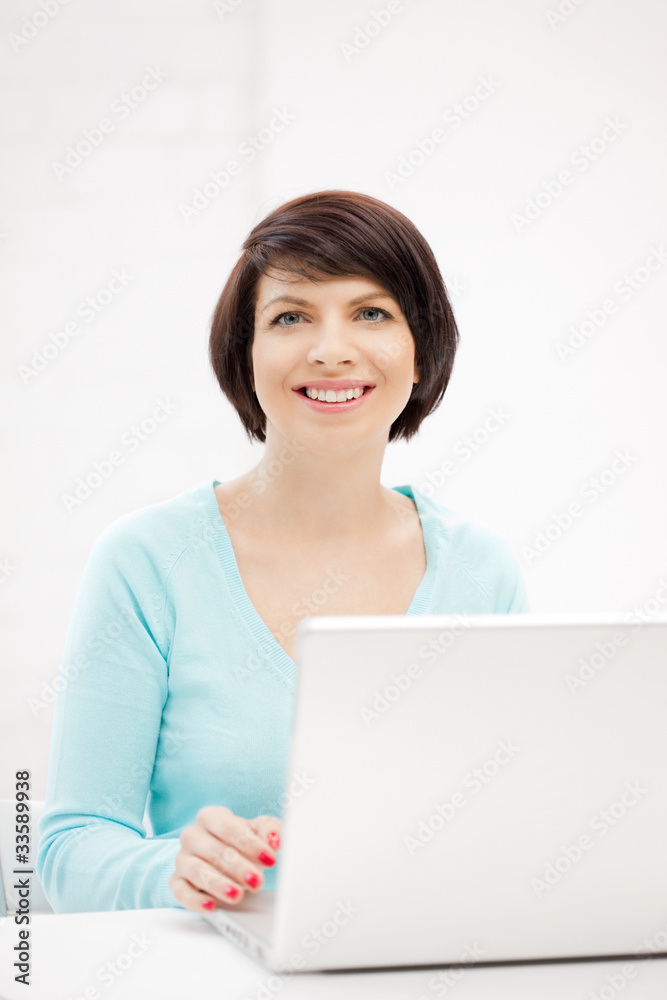 happy woman with laptop computer