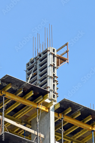 Detail of building construction site against blue sky