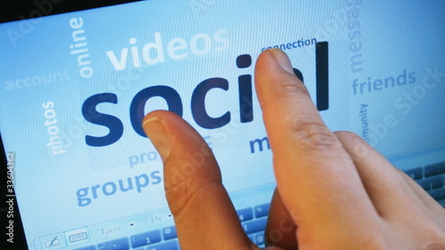 social media and connected words on touch-screen tablet-pc