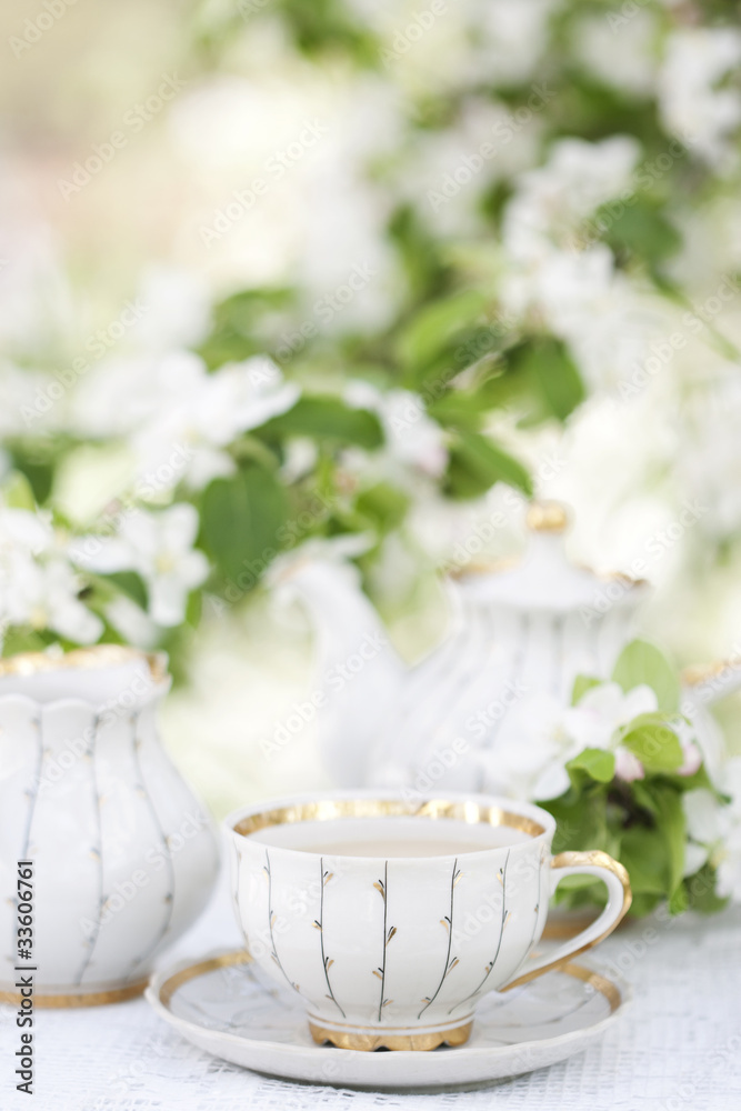 Tea in the blossoming garden Tea in the blossoming garden