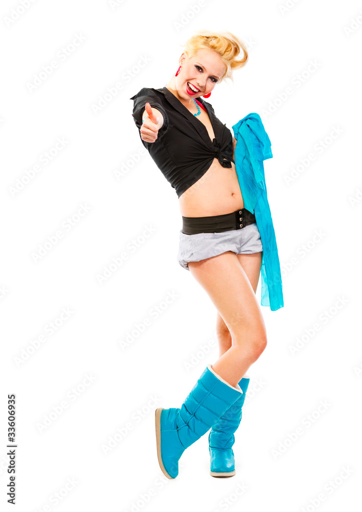 Smiling girl with blue scarf showing thumbs up