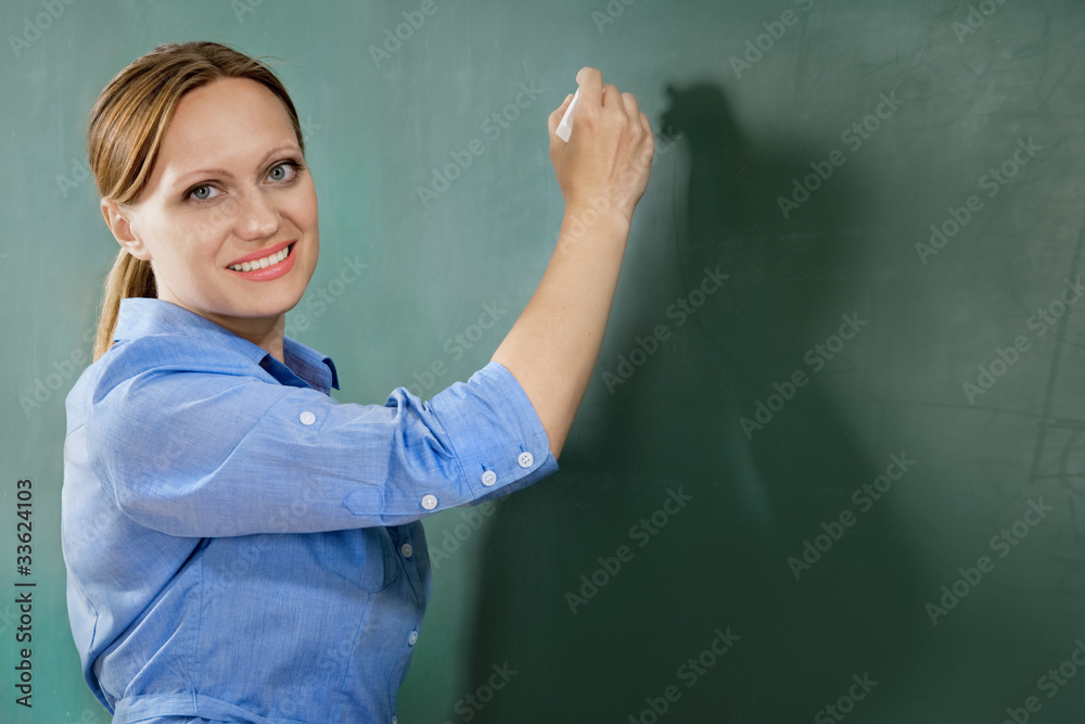 attractive teacher or student at the blackboard attractive teacher or student at the blackboard
