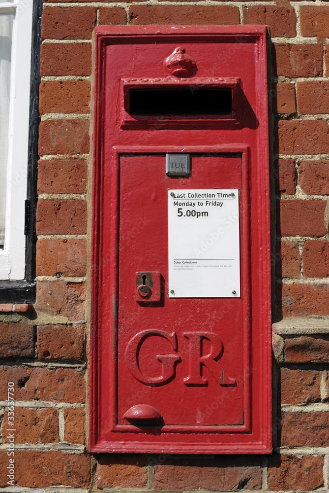 English Red postbox mounted on wall English Red postbox mounted on wall