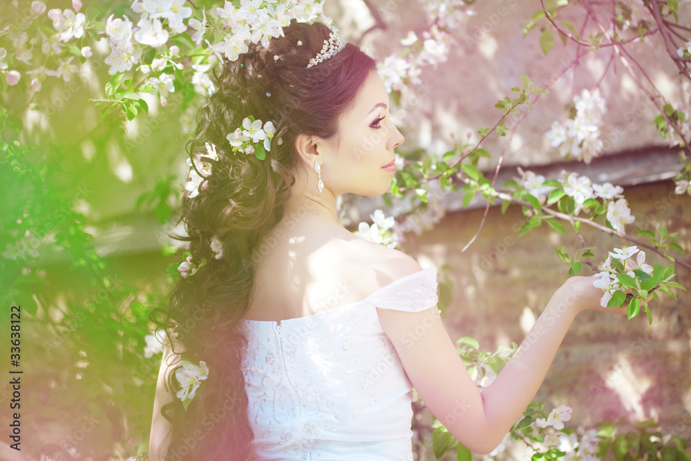 Beautiful bride in a blossoming garden Beautiful bride in a blossoming garden