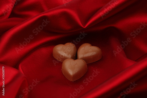 candy hearts on red satin