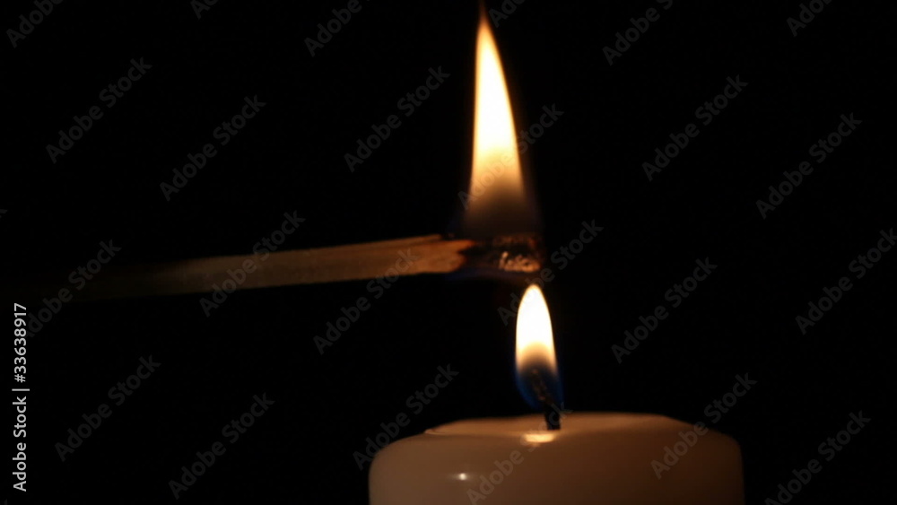Candle being lit and blown out.