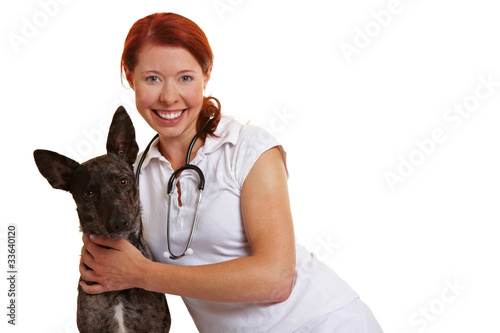 Lachende Tierärztin mit Hund photo