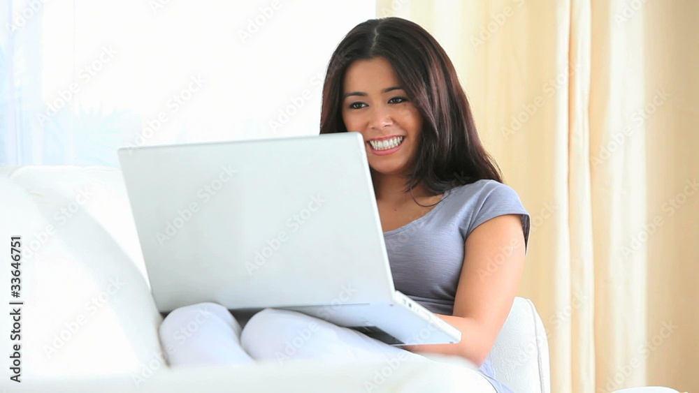 Cute brunette working with her laptop Cute brunette working with her laptop