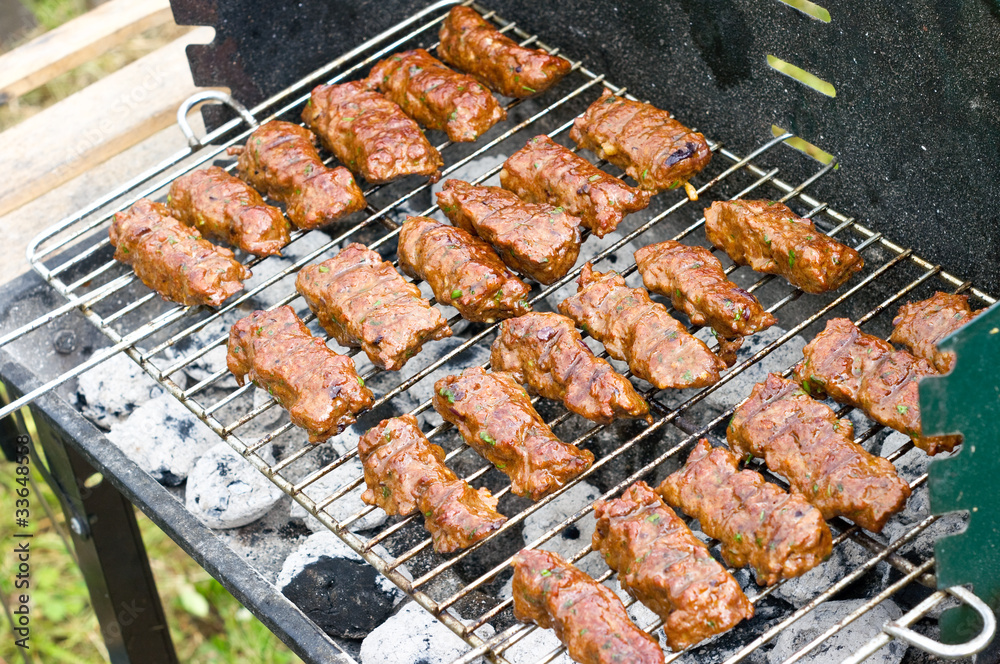 Traditional Croatian cevapcici on the grill