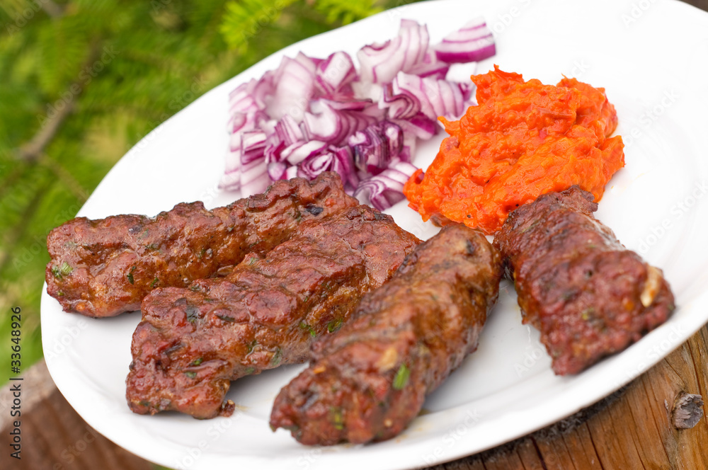 Cevapcici with ajvar paste and red onion Cevapcici with ajvar paste and red onion
