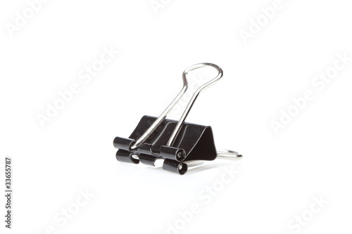 A black binder clip