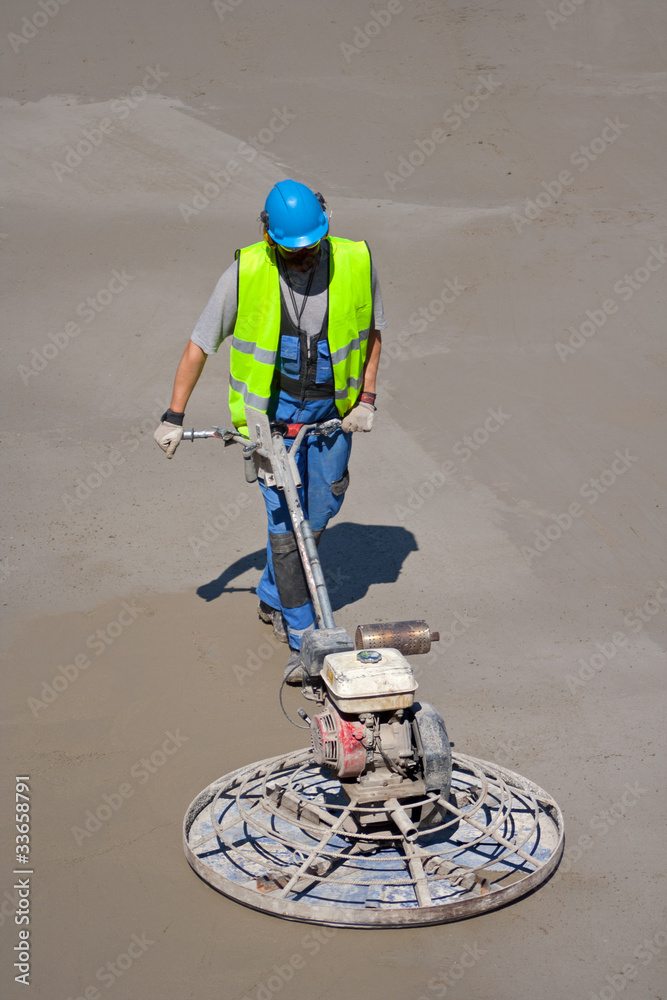 Power trowel machine and construction worker