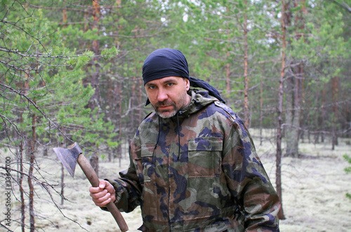 Man with an ax in the forest