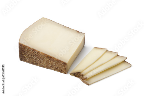 Piece of Swiss Gruyere cheese ans slices