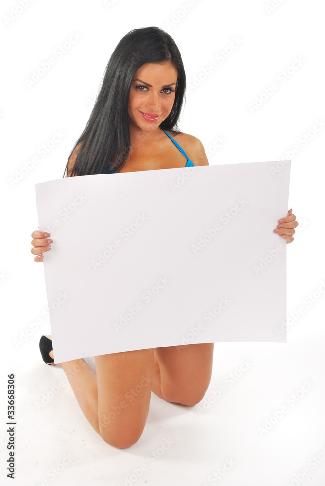 pretty girl kneeling with blank notice board