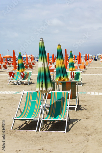Wallpaper Mural deckchairs and umbrella on the beach Torontodigital.ca