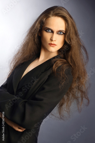 Portrait of beautiful woman with long thick brown hair