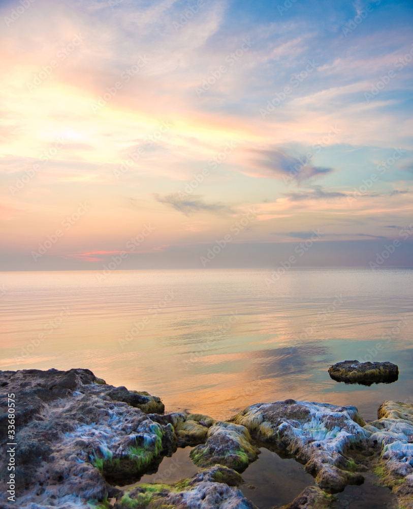 Sea and rock at the sunset. Seascape composition. Sea and rock at the sunset. Seascape composition.