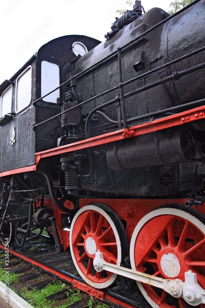 Naklejka premium wheel of the old locomotive on stop