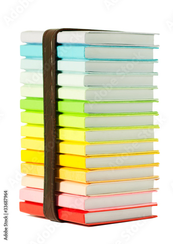 Stack of colorful books on the white background
