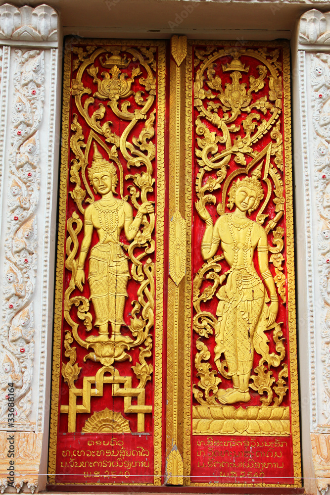 Door sculpture in Laos temple