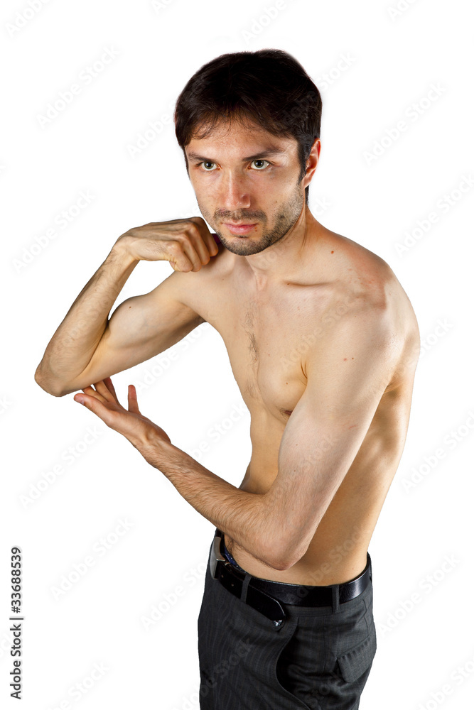 very skinny guy flexing its muscles Stock Photo