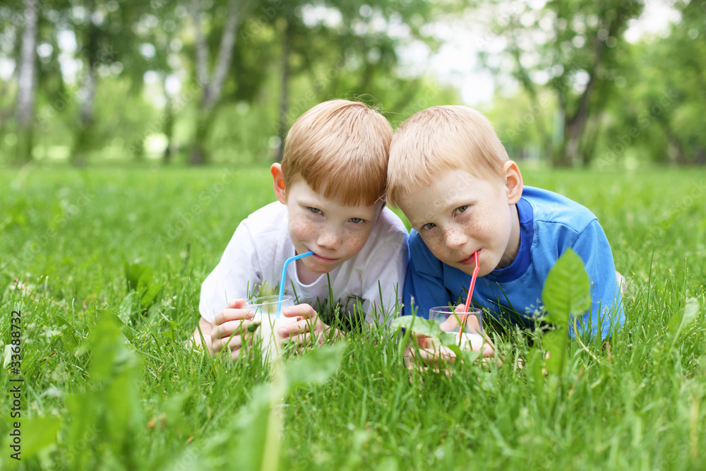Portrait of two boys in the summer outdoors Portrait of two boys in the summer outdoors