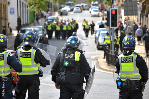 Rear view of police officers at EDL demonstration in Halifax