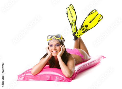 Girl on beach mattress photo