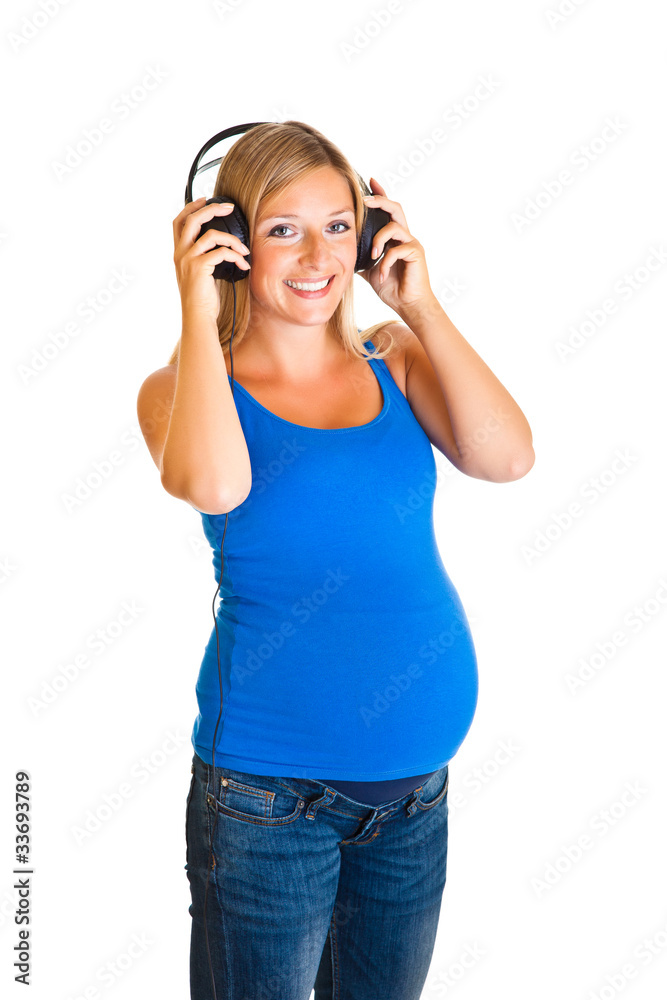 Pregnant woman with headphones isolated on white Pregnant woman with headphones isolated on white