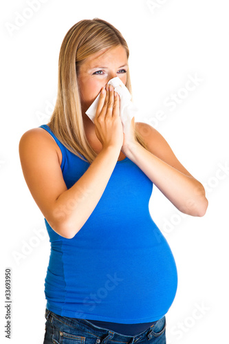 Pregnant woman wiping nose isolated on white