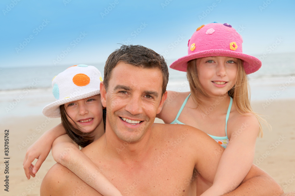 Father with children at the beach