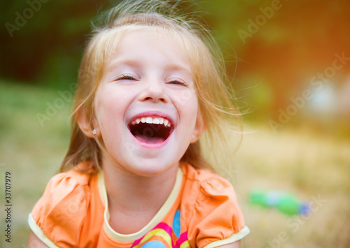 Cute little girl on the meadow