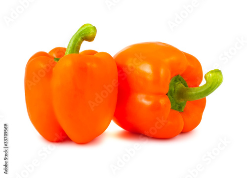 Two ripe orange peppers