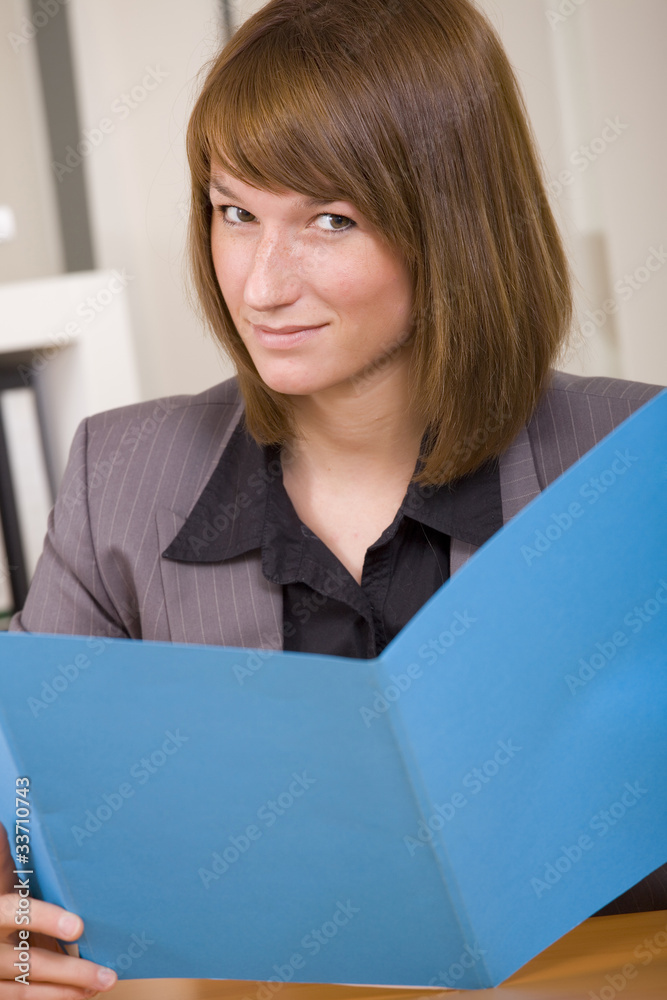 woman reading application file woman reading application file