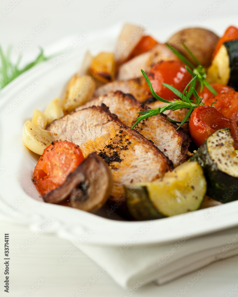 Rustic roast pork with vegetables,mushrooms and herbs Rustic roast pork with vegetables,mushrooms and herbs