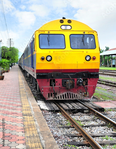 Thai colorful train arriving at station