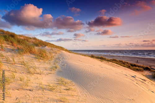 Seaside with sand dunes at sunset © pwollinga