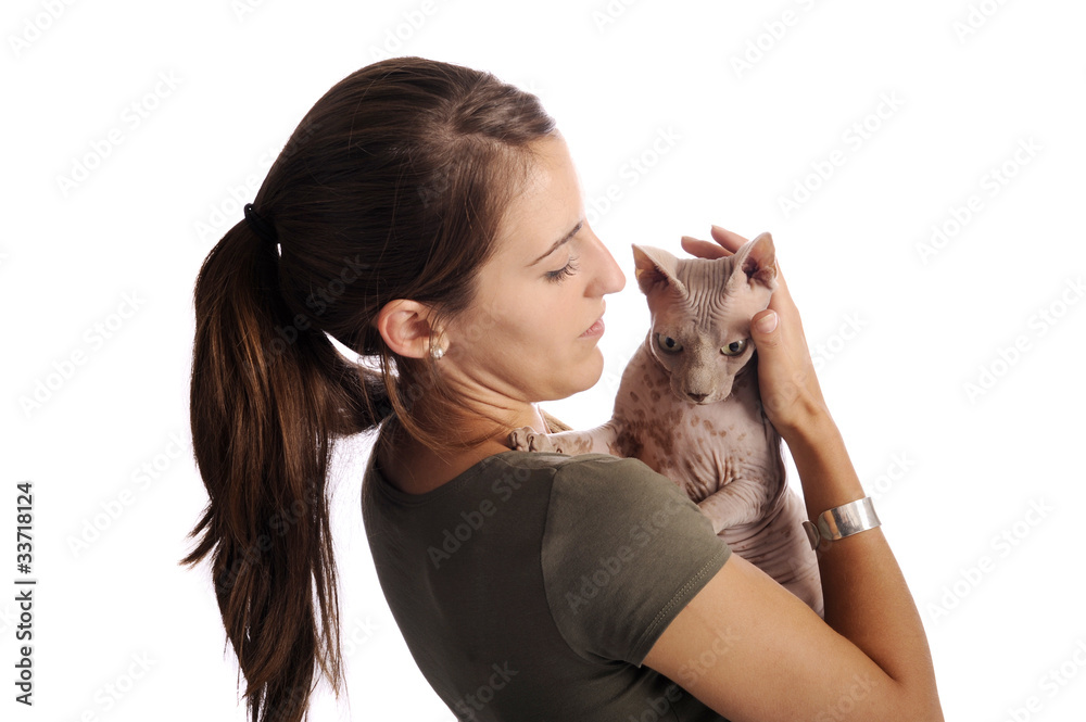 young woman holding a sphynx cat