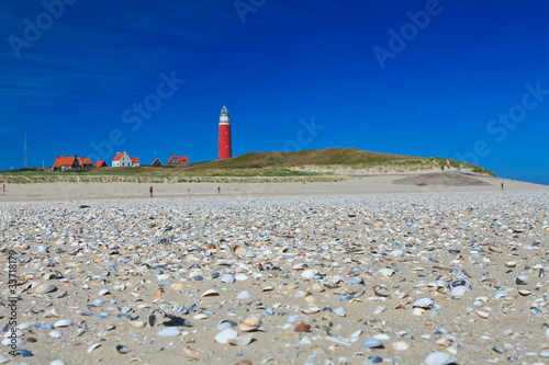 Seaside with sand dunes and lighthouse