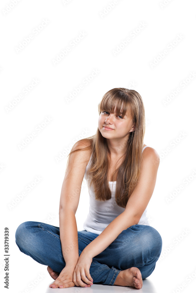 Smiling teenager girl sitting Smiling teenager girl sitting