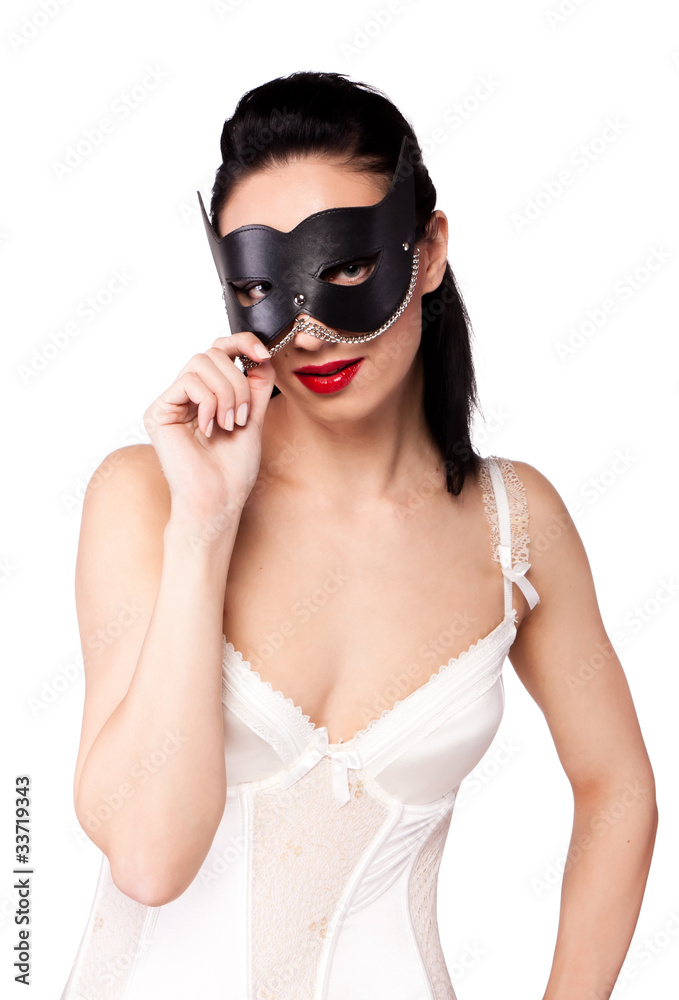 A girl in a black mask and a fan