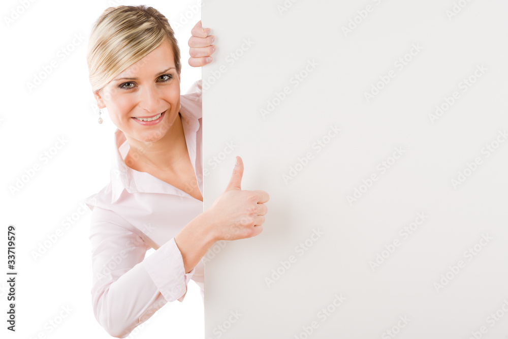 Happy businesswoman behind empty banner thumbs up Happy businesswoman behind empty banner thumbs up