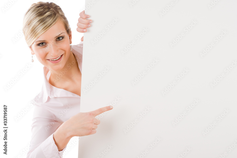 Businesswoman pointing aside at white banner Businesswoman pointing aside at white banner