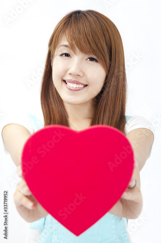 pretty asian girl giving red heart gift box