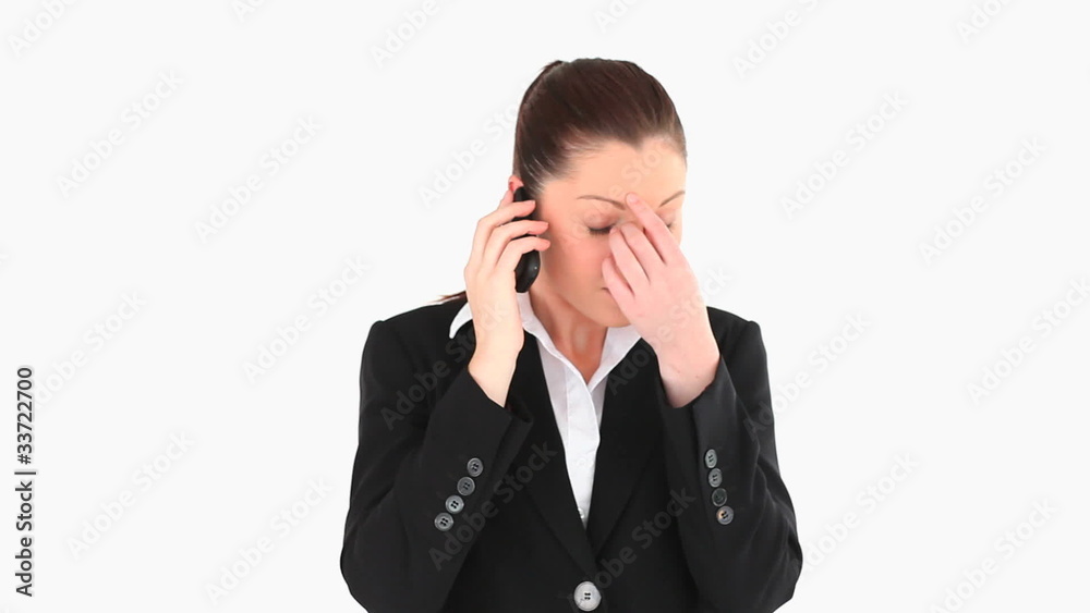 Angry businesswoman telephoning