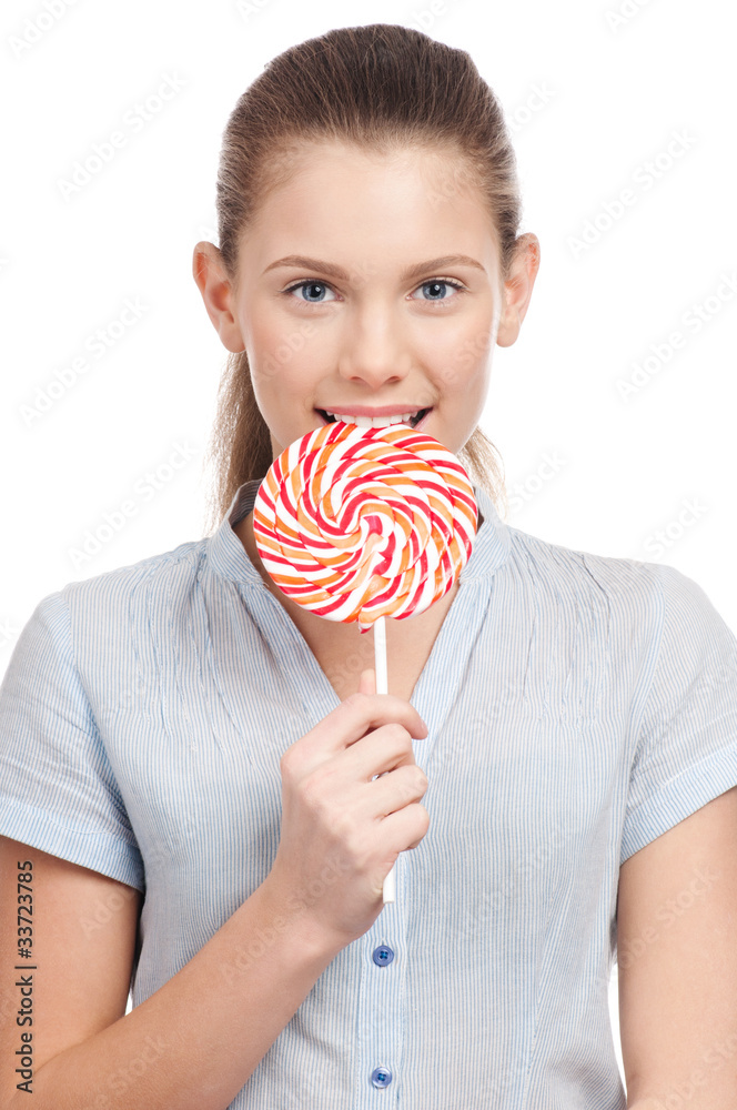Pretty young woman with lollipop. Isolated