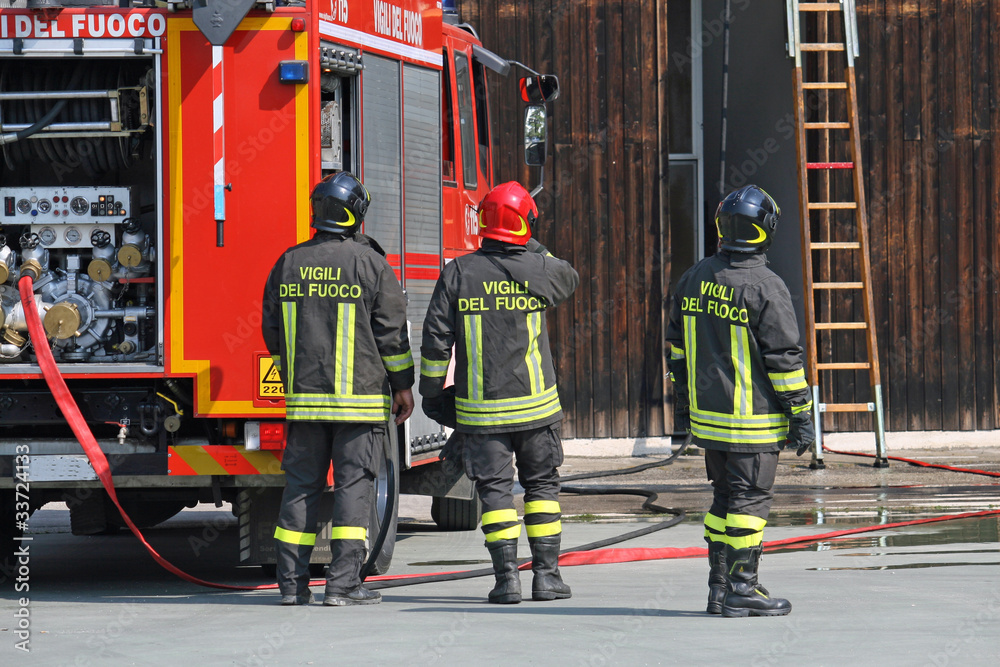 firefighters during a training exercise in their fire station