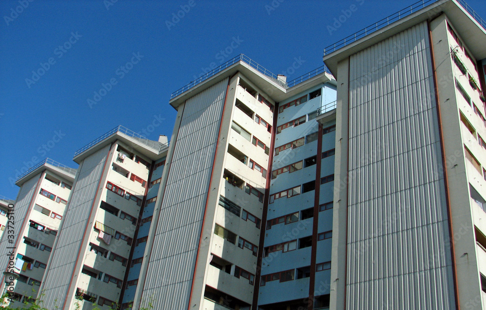 large apartment buildings with terraces crowded